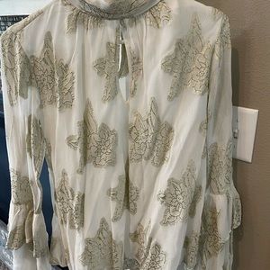 Beautiful cream blouse with shimmery flowers